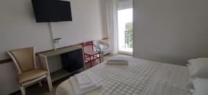 Postel nebo postele na pokoji v ubytování Hotel Internazionale