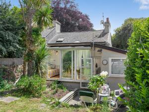 a small house with a garden and a patio at Teign Retreat in Teignmouth