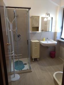 a bathroom with a shower and a sink at La Casa di Cesarina in Celle sul Rigo