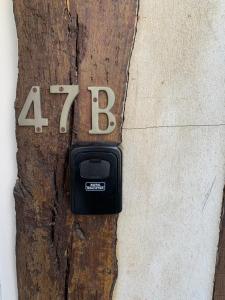 a lock on a wooden door with the number at Honfleur effet mer 2 in Honfleur