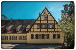 a large house with a gambrel roof at Jugendhotel Nürnberg in Nürnberg