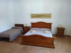 En eller flere senge i et værelse på Casa nella Fortezza