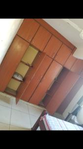 a ceiling with wooden cabinets in a room at Amar ak house in Mombasa