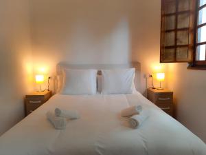 Giường trong phòng chung tại Prau Llagar, megustarural