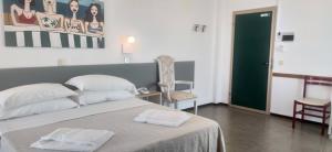 Postel nebo postele na pokoji v ubytování Hotel Internazionale