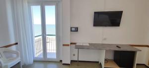 TV a/nebo společenská místnost v ubytování Hotel Internazionale