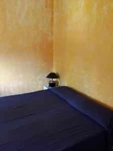 Un ou plusieurs lits dans un hébergement de l'établissement Vacanze in Sardegna a Posada