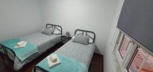 Postel nebo postele na pokoji v ubytování PISO IRIA