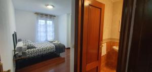 Postel nebo postele na pokoji v ubytování PISO IRIA