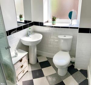 a bathroom with a toilet and a sink at Princes House, Park Way in Liverpool