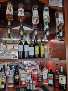a bar with lots of bottles of alcohol on shelves at The Raceby Hotel, Doncaster South Yorkshire, Part of the AG Collection in Doncaster +10 photos