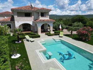 an image of a house with a swimming pool at Villa Anna - 4 bedrooms, 4 bathrooms, heated pool, jacuzzi in Kornić