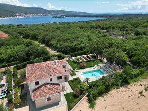 an aerial view of a house with a swimming pool at Villa Anna - 4 bedrooms, 4 bathrooms, heated pool, jacuzzi in Kornić