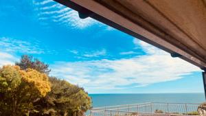 a view of the ocean from a balcony at Family Marine Apartment with Sea View in Dawlish