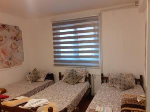 Postel nebo postele na pokoji v ubytování Apartmani "Helena"