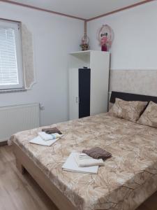 Postel nebo postele na pokoji v ubytování Apartmani "Helena"