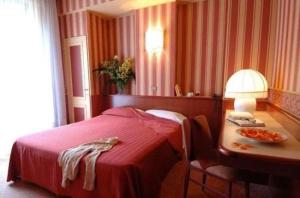 Postel nebo postele na pokoji v ubytování Hotel Garda