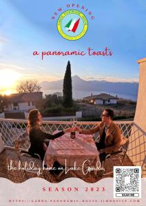 een poster voor een romantisch resort met twee personen aan een tafel bij Garda Panoramic House in Albisano