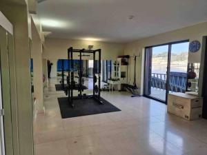 a room with a gym with a view of the ocean at Central duplex apartment-full view of Douro river in Vila Nova de Gaia