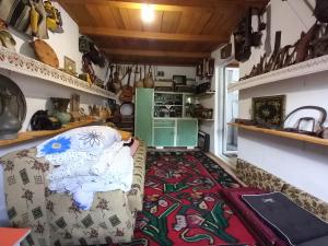 a living room with a couch and a rug at Apartman Bosanska Avlija-Muzej- in Visoko