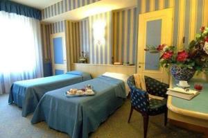 Postel nebo postele na pokoji v ubytování Hotel Garda