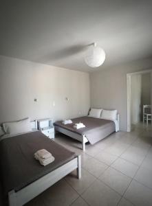 Postel nebo postele na pokoji v ubytování Demis Apartments