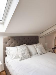 Postel nebo postele na pokoji v ubytování La Loggia dei Conti