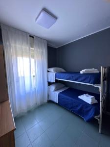Postel nebo postele na pokoji v ubytování Hotel Montebello Riccione