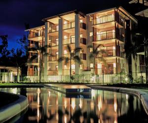 a building with a pool in front of it at Blue Lagoon Resort in Trinity Beach