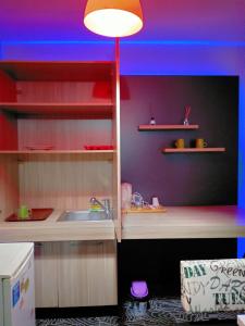 a kitchen with a sink and a blue ceiling at İNCİ HOUSE in Kırac