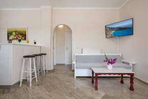 a living room with a couch and a table at Elena Hara in Alikanas