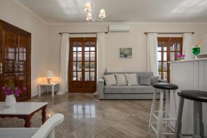 a living room with a couch and a table at Elena Hara in Alikanas