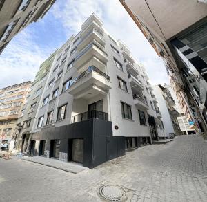 a large white building on a city street at NORA SUİTE in Trabzon