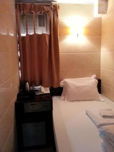 Katil atau katil-katil dalam bilik di Joyous Guest House
