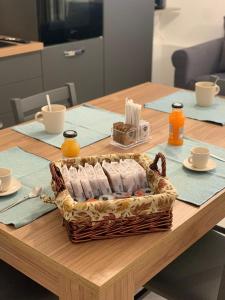 a basket ofented candles sitting on a table at Appartamento Camelia in Palo del Colle