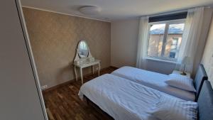 Postel nebo postele na pokoji v ubytování Kivi Residence