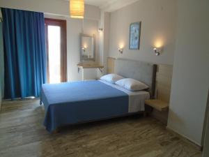 Postel nebo postele na pokoji v ubytování Polyxeni Hotel