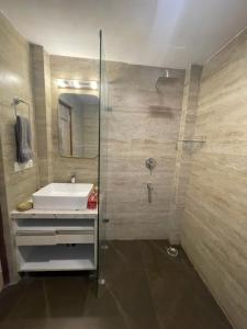 a bathroom with a sink and a shower at Villa MYSA in Rāmgarh