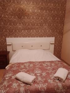 Rúm í herbergi á Tamuna Guest House