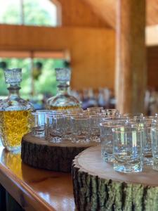 a group of glasses sitting on top of a table at Atpūtas komplekss Dridži in Krāslava +31 photos