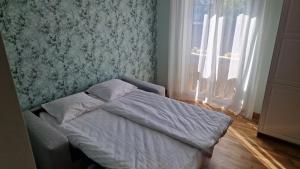 Postel nebo postele na pokoji v ubytování Kivi Residence