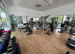 a gym with treadmills and exercise equipment in a room at MAI Desaru Utama Residence in Bandar Penawar