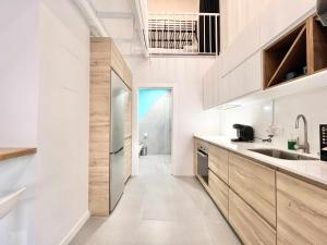 Kuchyň nebo kuchyňský kout v ubytování Apollo Project Coruña + 39 fotografií