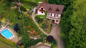 an aerial view of a house with a swimming pool at Veres in Yaremche