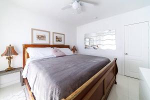 a bedroom with a large bed in a white room at 2 BEDROOM ON THE BEACH ! in Miami Beach