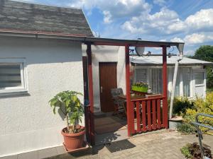 awning over a front porch of a house at Ferienwohnung Irmchen in Altglobsow