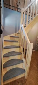 a set of stairs in a room at ORYNKA chatka w Malinnikach in Malinniki +9 photos