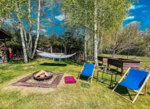 Vonkajšia záhrada v ubytovaní Apartament pod brzozami -Tomaszkowo + 5 fotografií