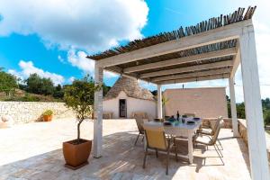 A patio or other outdoor area at Trullo Caelum
