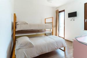 A bed or beds in a room at Trullo Caelum